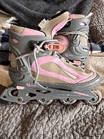 Full view of left sides of both skates showing colour, design and condition