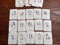 Grid of 15 illustrated author cards with stack of additional cards above