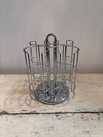 Angled view of chrome rotating K-Cup pod holder on tabletop