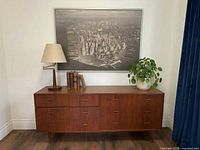 Framed Manhattan photograph hung above sideboard