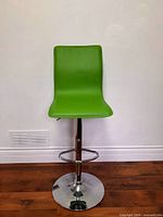 Front view of lime green faux leather adjustable barstool on chrome pedestal base