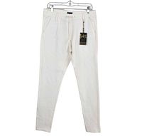 Front view of white jogger pants on hanger, tag visible
