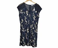 Full front view of navy floral dress on hanger