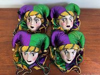 Front view of all four jester wall ornaments