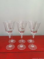 Front view of six matching crystal stemware glasses