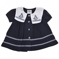 Front view of navy sailor dress with bib collar and gingham buttons