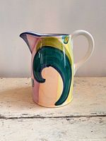 Left profile of multicolor ceramic pitcher