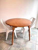 Table shown round with drop leaves extended