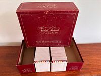 Outer box open showing two card sleeves and stacks of cards