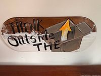 Full view of wooden wall sign showing text and illustration