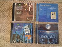 Front covers of all four CDs