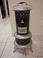 Front view showing decorative vents, patent plate, footed base