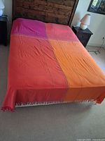 Bed cover on bed showing full size and gradient colors