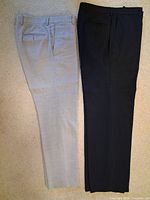Black and gray dress pants side by side