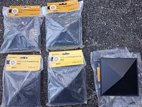 Five post caps, four sealed in bags, one unsealed