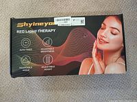 Retail box showing brand Shyineyou and feature icons