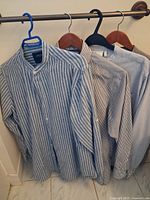 All four shirts hanging on rail