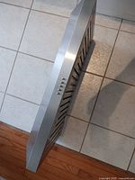 Side angle view showing stainless finish and push-button controls