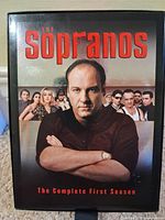 Front of slipcase showing series title and cast image