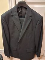 Front view of the Van Heusen jacket on hanger