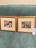 Both framed Renoir prints side by side