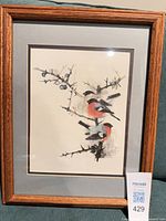 Framed bird print full view on couch