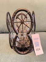 Front view of glass vase inside iron horseshoe holder