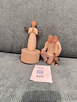 Both Willow Tree figurines on couch