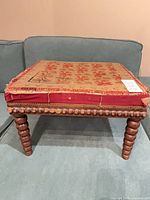 Full view of stool showing top upholstery and legs