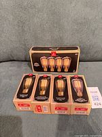 Front view of all five unopened packs showing brand, Vintage line, and bulb quantity