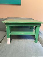 Full view of green side table on sofa