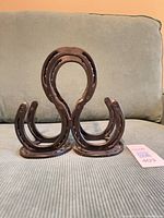 Front view of welded horseshoe wine holder