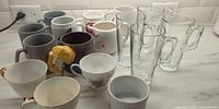 overview of all mugs, teacups, glass mugs and ramekin