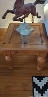 Square light wood side table with horse statue and candle (accessories not included)