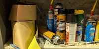 Shelf with flashing roll, multiple foam cans, adhesive tube