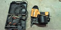 Overview of both tools: Bostitch coil nailer and Tacklife jigsaw in case
