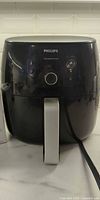 Front view of Philips XL air fryer showing control panel and handle