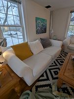 Front view of Sklar Peppler sofa with pillows