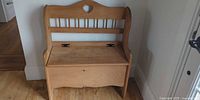 Front view of light wood storage bench