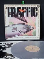 Front cover showing album title, artwork, and track list