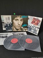 Front view of gatefold jacket fully opened with both LPs and insert visible