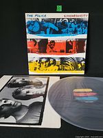 Front of Synchronicity jacket, inner sleeve and vinyl disc visible