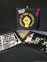 Front of gatefold sleeve with fist logo