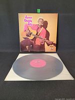 Front of album sleeve featuring Sweet Daddy Siki with guitar