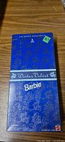 Front of blue patterned Winter Velvet Barbie box
