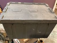 Closed gray plastic storage box front view