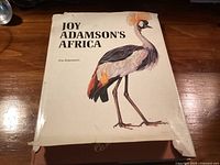 Front of dust-jacketed book showing title and crowned crane artwork