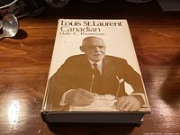 Front cover of hardcover book with dust jacket showing title and portrait