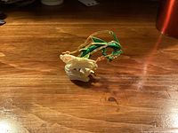 Front view showing Rayquaza figure and swirl base