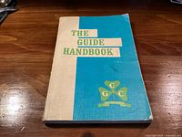 Front cover showing title, emblem and wear